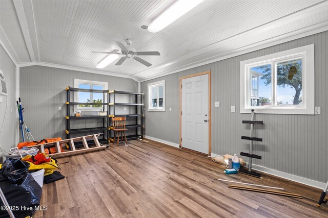 game room featuring wood finished floors, crown molding, baseboards, and ceiling fan