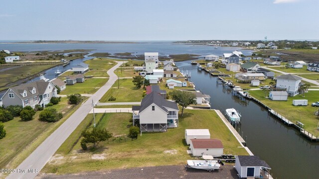 aerial perspective of suburban area featuring a nearby body of water