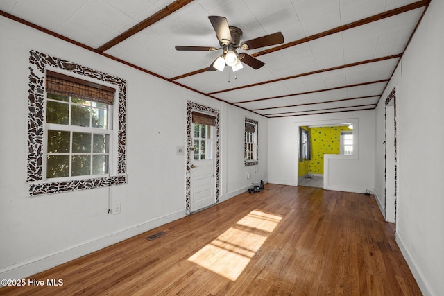 2205 Bay St, Morehead City, NC 28557 - unfurnished room featuring baseboards, a ceiling fan, hardwood / wood-style flooring, and visible vents