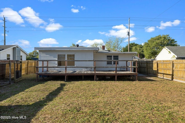 2205 Bay St, Morehead City, NC 28557 - back of house with a lawn, a fenced backyard, and a wooden deck