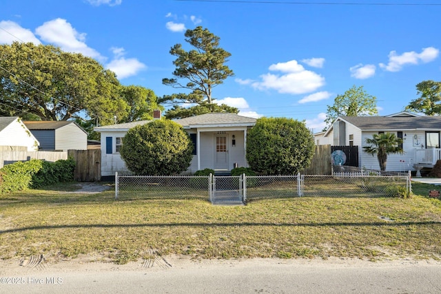 2205 Bay St, Morehead City, NC 28557 - view of front of house featuring a gate, a fenced front yard, a chimney, and a front yard