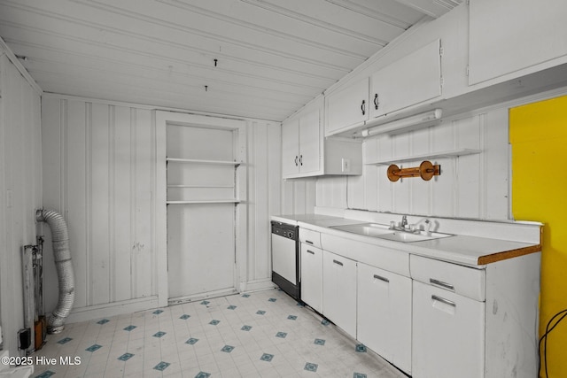 2205 Bay St, Morehead City, NC 28557 - kitchen with white cabinets, light countertops, a sink, and dishwasher
