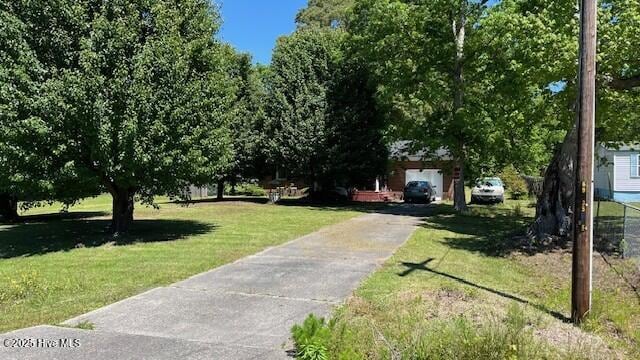 1817 Cobb Rd, Kinston, NC 28501 - surrounding community with a lawn and driveway