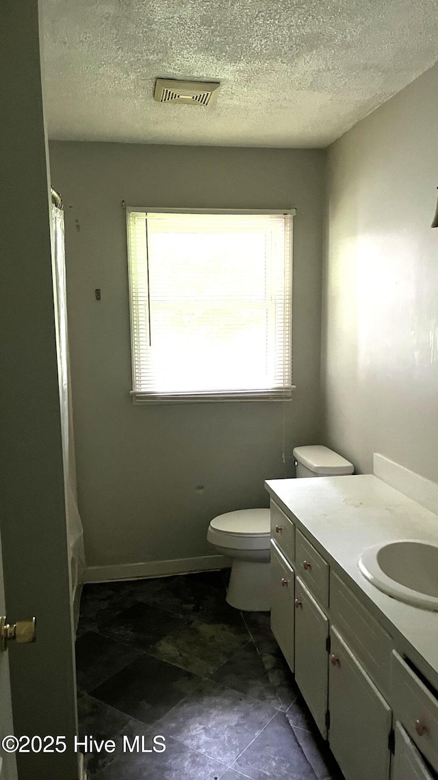 1817 Cobb Rd, Kinston, NC 28501 - bathroom with vanity, toilet, and a textured ceiling