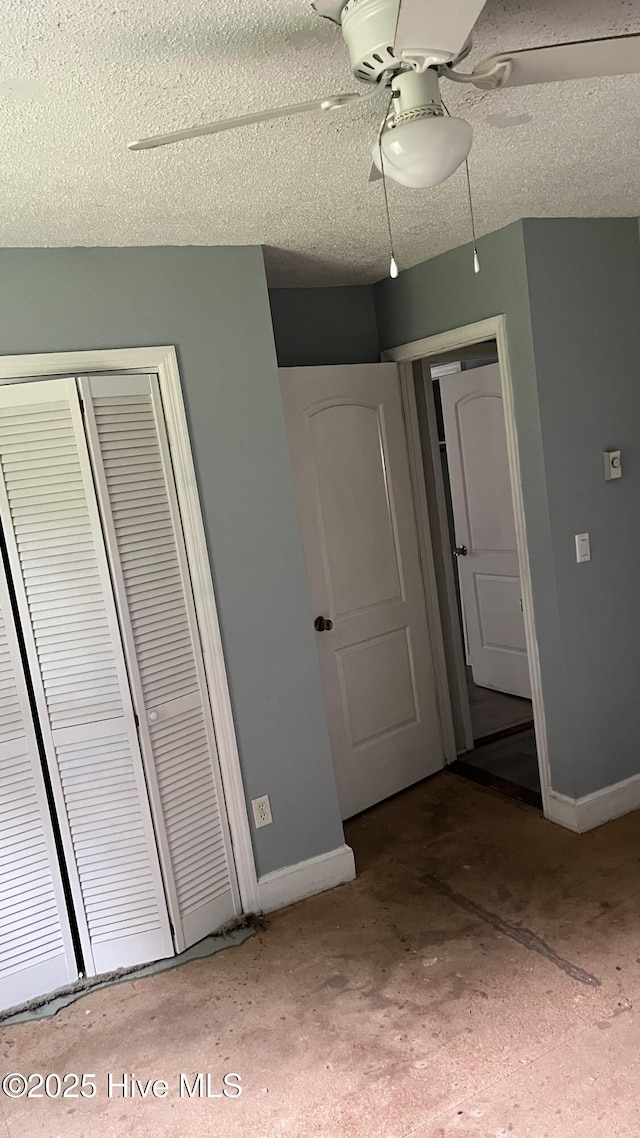 1817 Cobb Rd, Kinston, NC 28501 - unfurnished bedroom featuring baseboards, a closet, a ceiling fan, and a textured ceiling