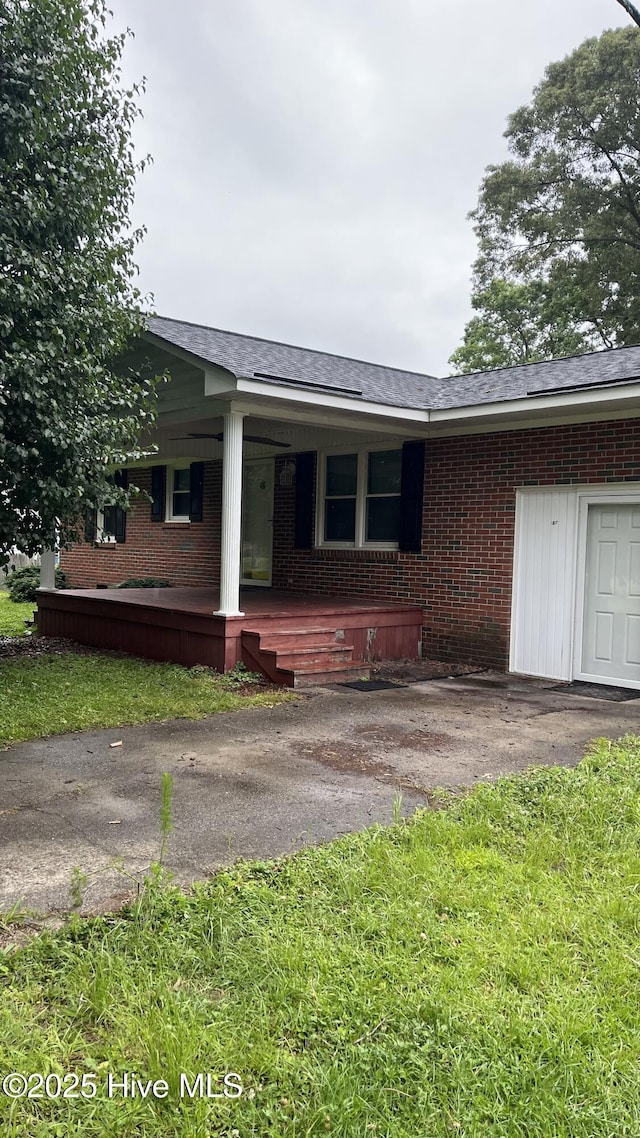 1817 Cobb Rd, Kinston, NC 28501 - view of front of property with brick siding, covered porch, and roof with shingles