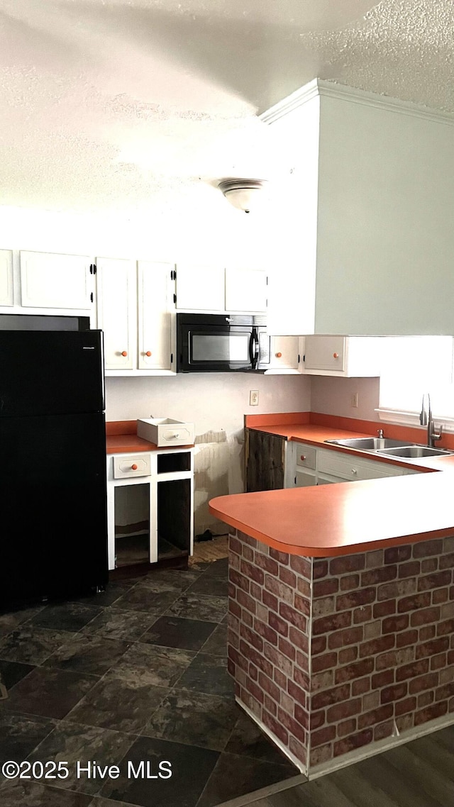 1817 Cobb Rd, Kinston, NC 28501 - kitchen with black appliances, white cabinetry, a sink, a textured ceiling, and crown molding