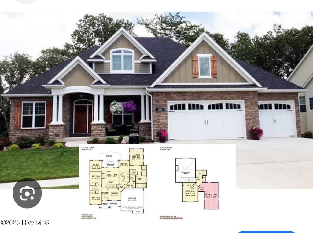 view of front of property with board and batten siding, driveway, and stone siding