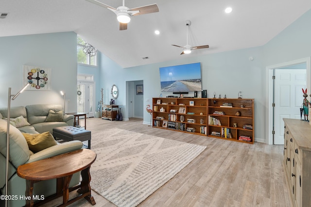 2403 W Oak Island Dr, Oak Island, NC 28465 - living area with a ceiling fan, high vaulted ceiling, light wood finished floors, and baseboards