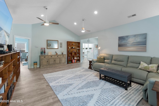 2403 W Oak Island Dr, Oak Island, NC 28465 - living room featuring ceiling fan, high vaulted ceiling, light wood finished floors, and recessed lighting