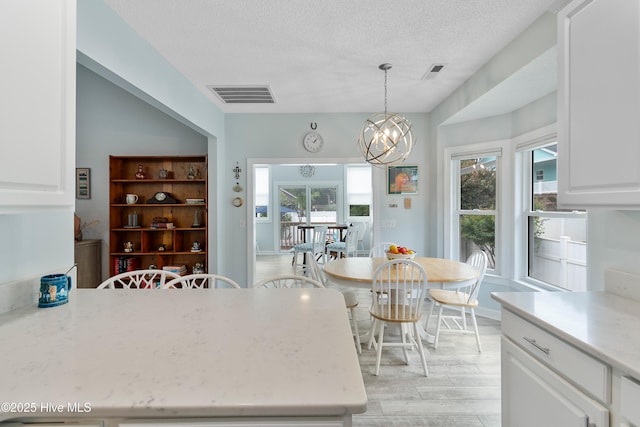 2403 W Oak Island Dr, Oak Island, NC 28465 - kitchen featuring a sink, appliances with stainless steel finishes, a ceiling fan, white cabinetry, and recessed lighting