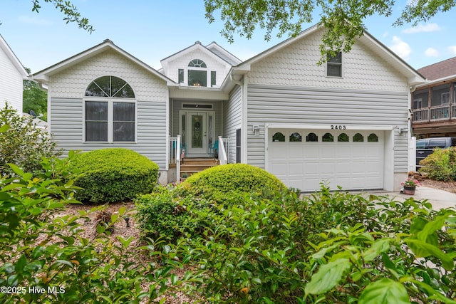 2403 W Oak Island Dr, Oak Island, NC 28465 - view of front of home with a garage and concrete driveway