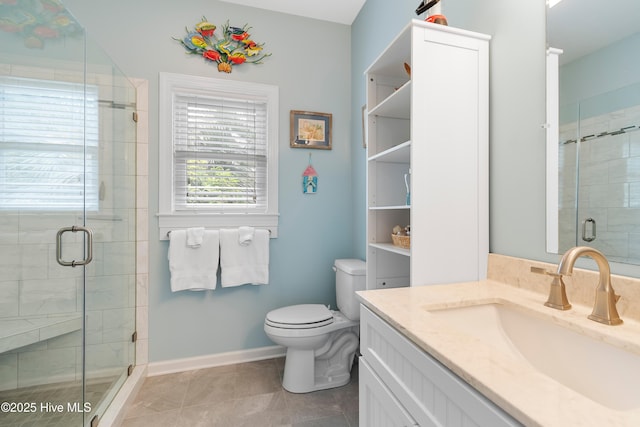 2403 W Oak Island Dr, Oak Island, NC 28465 - bathroom featuring a shower stall, toilet, vanity, and tile patterned flooring