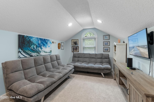 2403 W Oak Island Dr, Oak Island, NC 28465 - living room featuring a textured ceiling, vaulted ceiling, and carpet