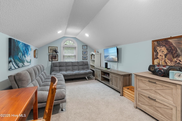 2403 W Oak Island Dr, Oak Island, NC 28465 - living area featuring a textured ceiling, vaulted ceiling, and light colored carpet
