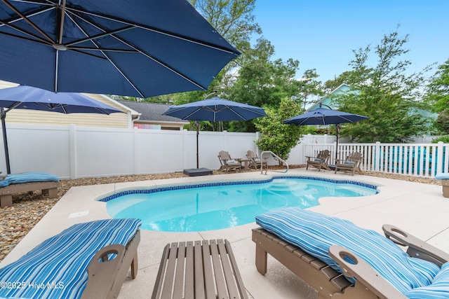 2403 W Oak Island Dr, Oak Island, NC 28465 - view of swimming pool featuring a fenced backyard and a patio area