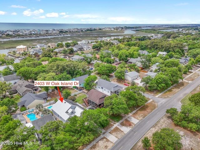 2403 W Oak Island Dr, Oak Island, NC 28465 - aerial view of property's location with a nearby body of water and nearby suburban area