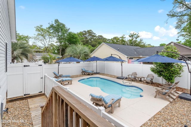 2403 W Oak Island Dr, Oak Island, NC 28465 - view of pool featuring a gate, a fenced backyard, and a patio area