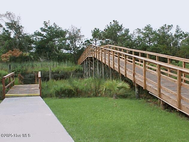 2403 W Oak Island Dr, Oak Island, NC 28465 - dock area featuring a yard