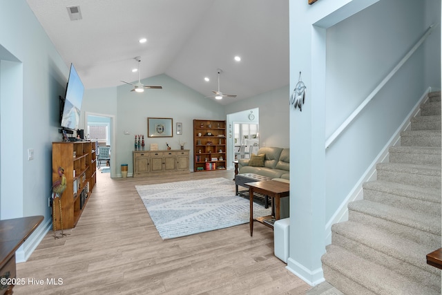 2403 W Oak Island Dr, Oak Island, NC 28465 - living room featuring stairway, ceiling fan, light wood-style flooring, baseboards, and recessed lighting