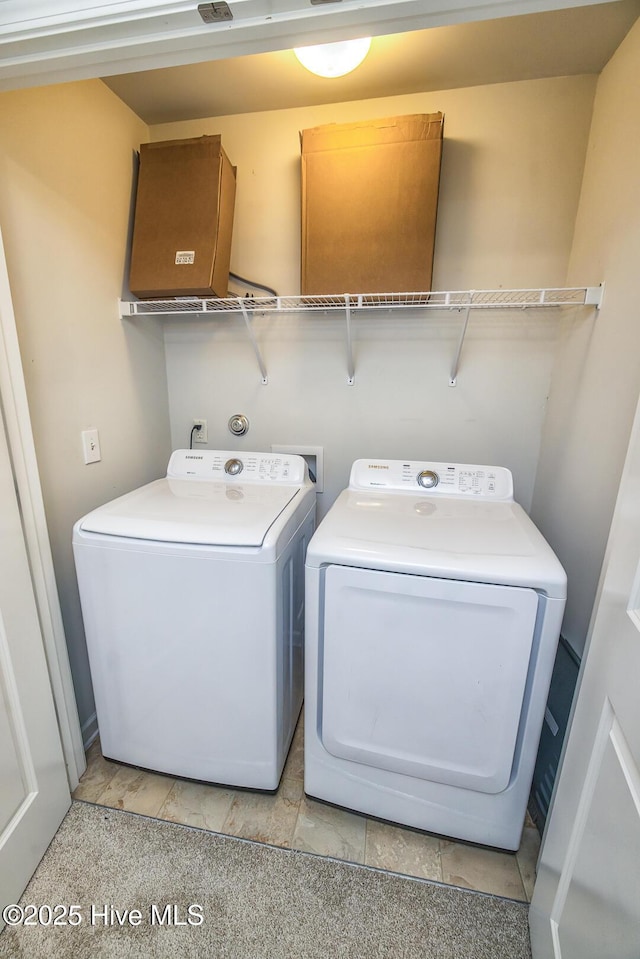 laundry area featuring laundry area and independent washer and dryer