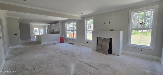1649 Butterfly Knot Dr SW, Ocean Isle Beach, NC 28469 - unfurnished living room with a wealth of natural light and baseboards