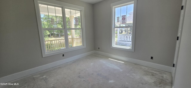 1649 Butterfly Knot Dr SW, Ocean Isle Beach, NC 28469 - unfurnished room with baseboards and unfinished concrete flooring