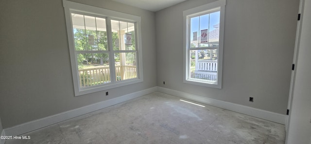 1649 Butterfly Knot Dr SW, Ocean Isle Beach, NC 28469 - empty room featuring baseboards and a healthy amount of sunlight