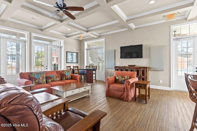 1649 Butterfly Knot Dr SW, Ocean Isle Beach, NC 28469 - living room with baseboards, beamed ceiling, a ceiling fan, and coffered ceiling