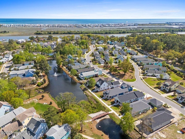 1649 Butterfly Knot Dr SW, Ocean Isle Beach, NC 28469 - birds eye view of property featuring a water view and a residential view