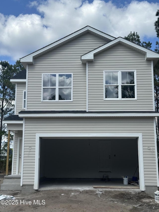 view of side of property with an attached garage