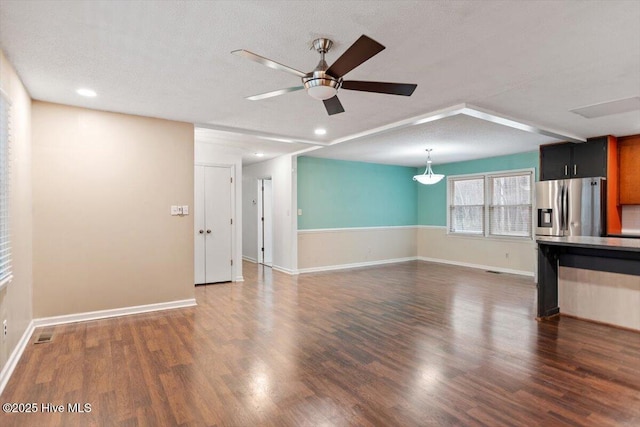 unfurnished living room featuring recessed lighting, a ceiling fan, baseboards, and wood finished floors