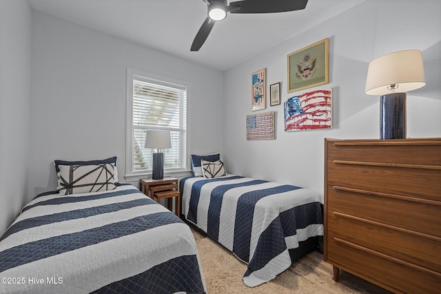carpeted bedroom featuring ceiling fan