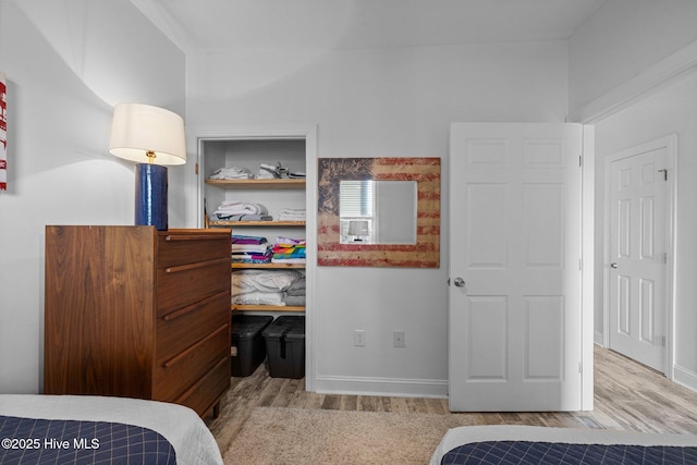 bedroom featuring wood finished floors