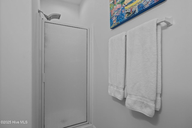 full bath featuring a shower stall