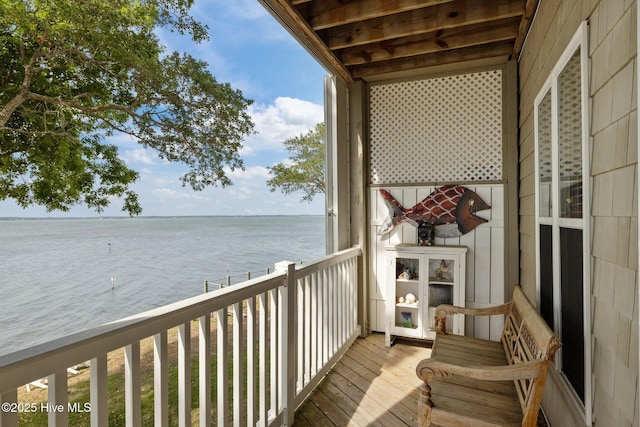 balcony featuring a water view