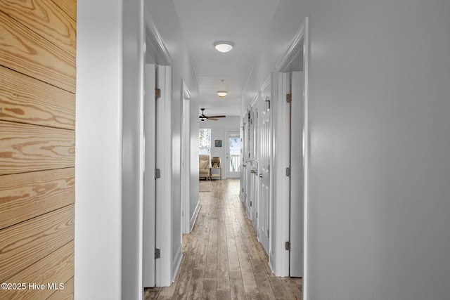 corridor with wood-type flooring