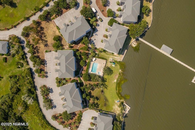 aerial perspective of suburban area featuring a nearby body of water