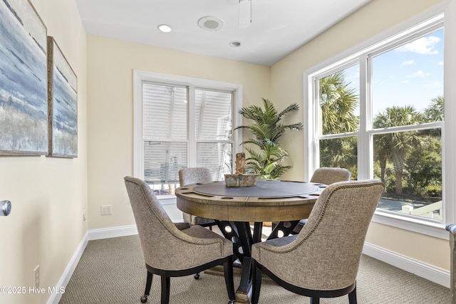 carpeted dining area with baseboards and recessed lighting