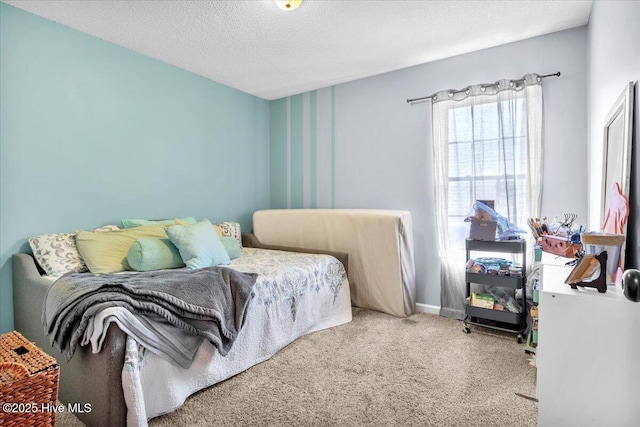 bedroom featuring carpet floors, a textured ceiling, and baseboards