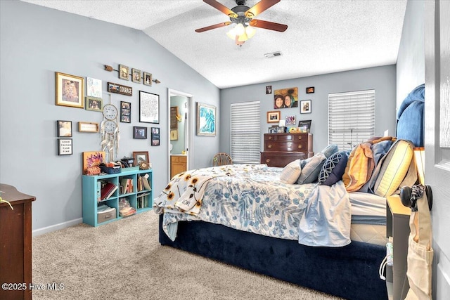 bedroom with carpet floors, a textured ceiling, a ceiling fan, lofted ceiling, and visible vents