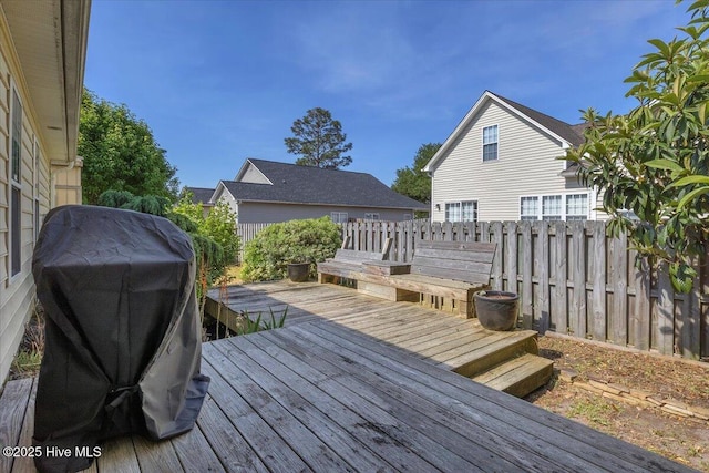 wooden deck featuring fence and grilling area