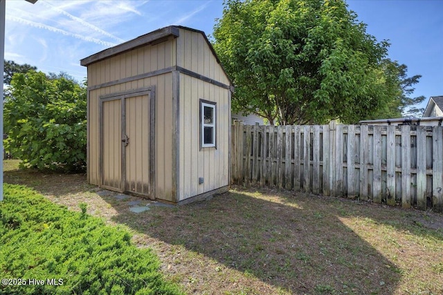 view of shed featuring a fenced backyard
