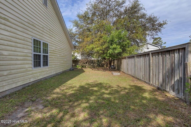 view of yard with a fenced backyard