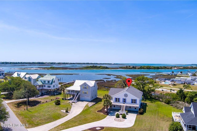 aerial view with a water view and a residential view