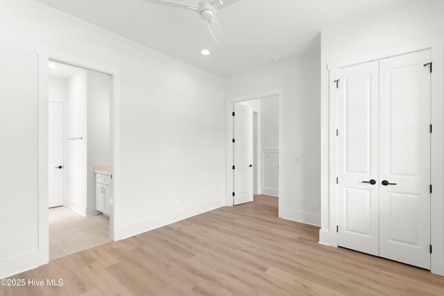 316 Lightning Bug Ln, Holly Ridge, NC 28445 - unfurnished bedroom featuring baseboards, a closet, light wood finished floors, connected bathroom, and recessed lighting