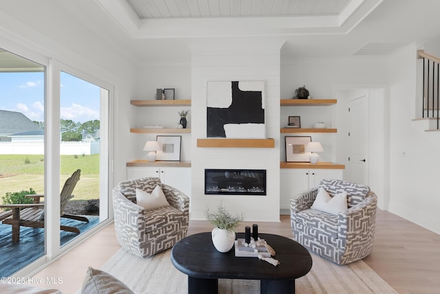 316 Lightning Bug Ln, Holly Ridge, NC 28445 - living room featuring built in features, a fireplace, wood finished floors, and stairway