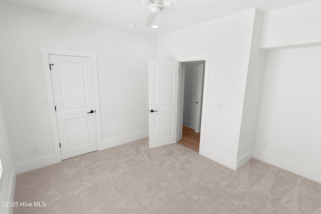 316 Lightning Bug Ln, Holly Ridge, NC 28445 - unfurnished bedroom with carpet flooring, a ceiling fan, and baseboards