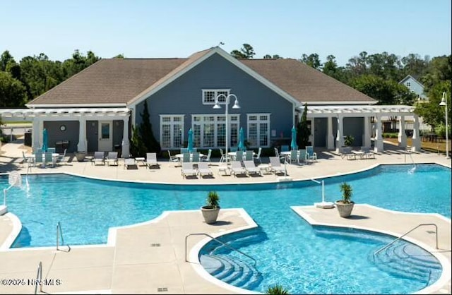 316 Lightning Bug Ln, Holly Ridge, NC 28445 - community pool featuring a patio and a pergola
