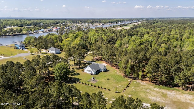 aerial view featuring a water view and a forest view